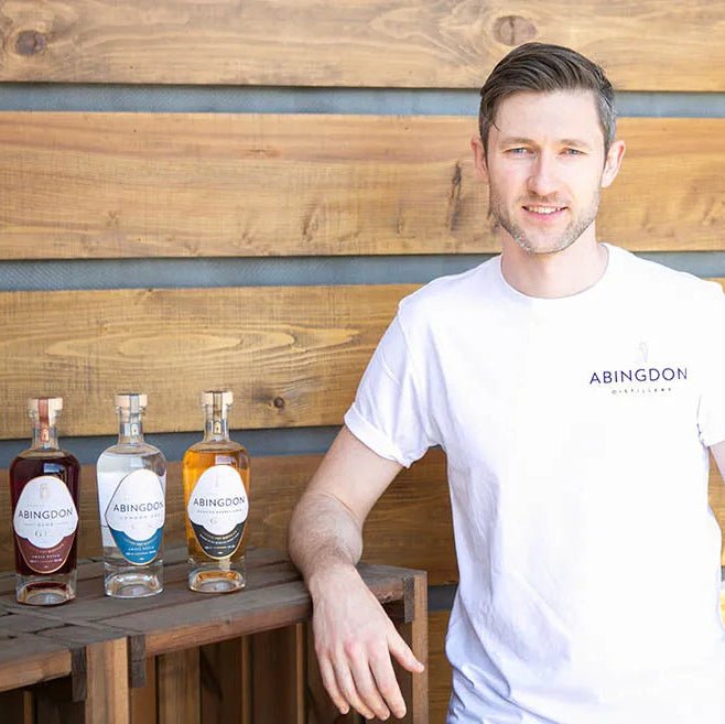 Head Distiller Jordan with bottles from Abingdon Distillery bottles