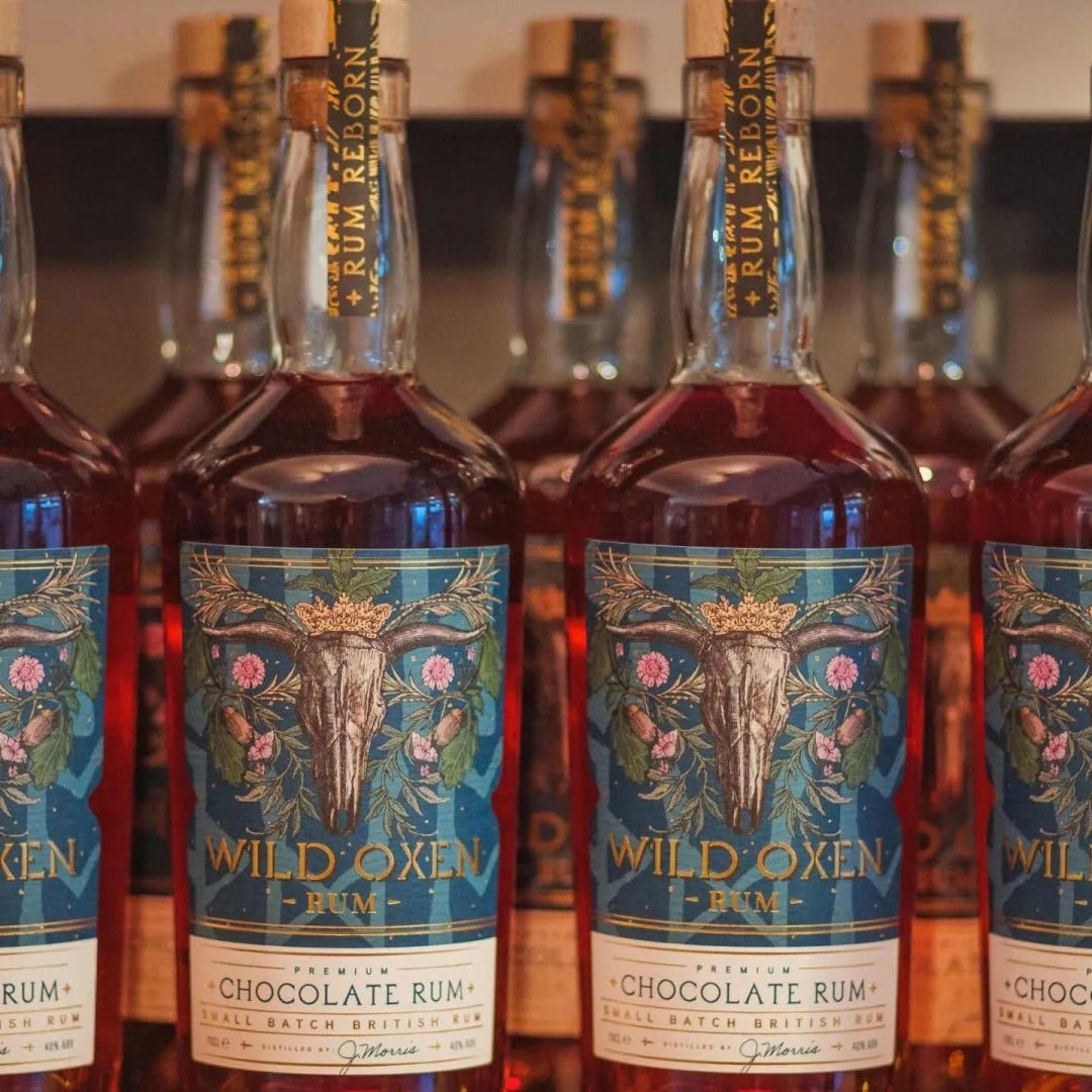 Bottles of Abingdon Chocolate Rum lined up on a shelf.