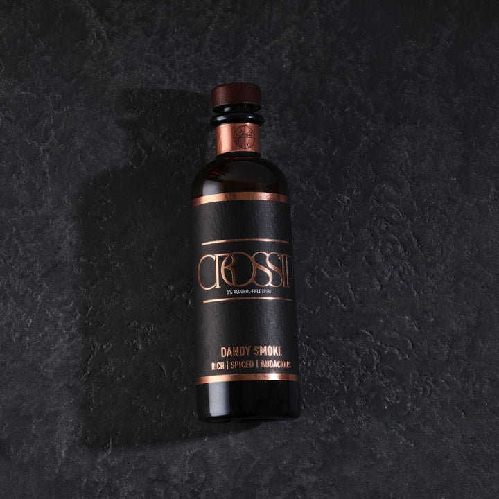 Bottle of Crossip Dandy Smoke on a dark textured background