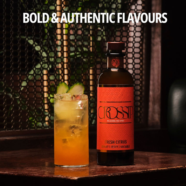 Bottle of Crossip Fresh Citrus with a cocktail on a wooden surface, featuring 'Bold & Authentic Flavours' text.