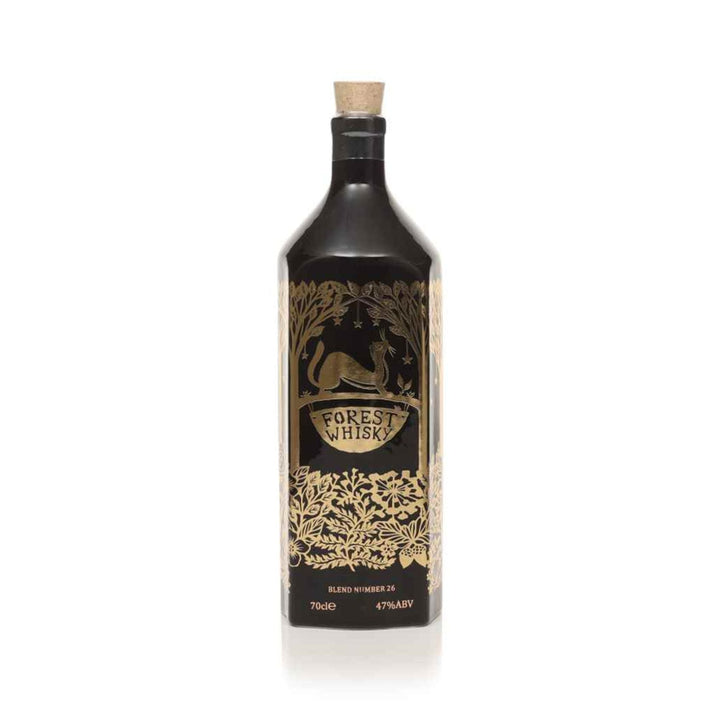 Black bottle of Forest Whisky with gold label on a white background