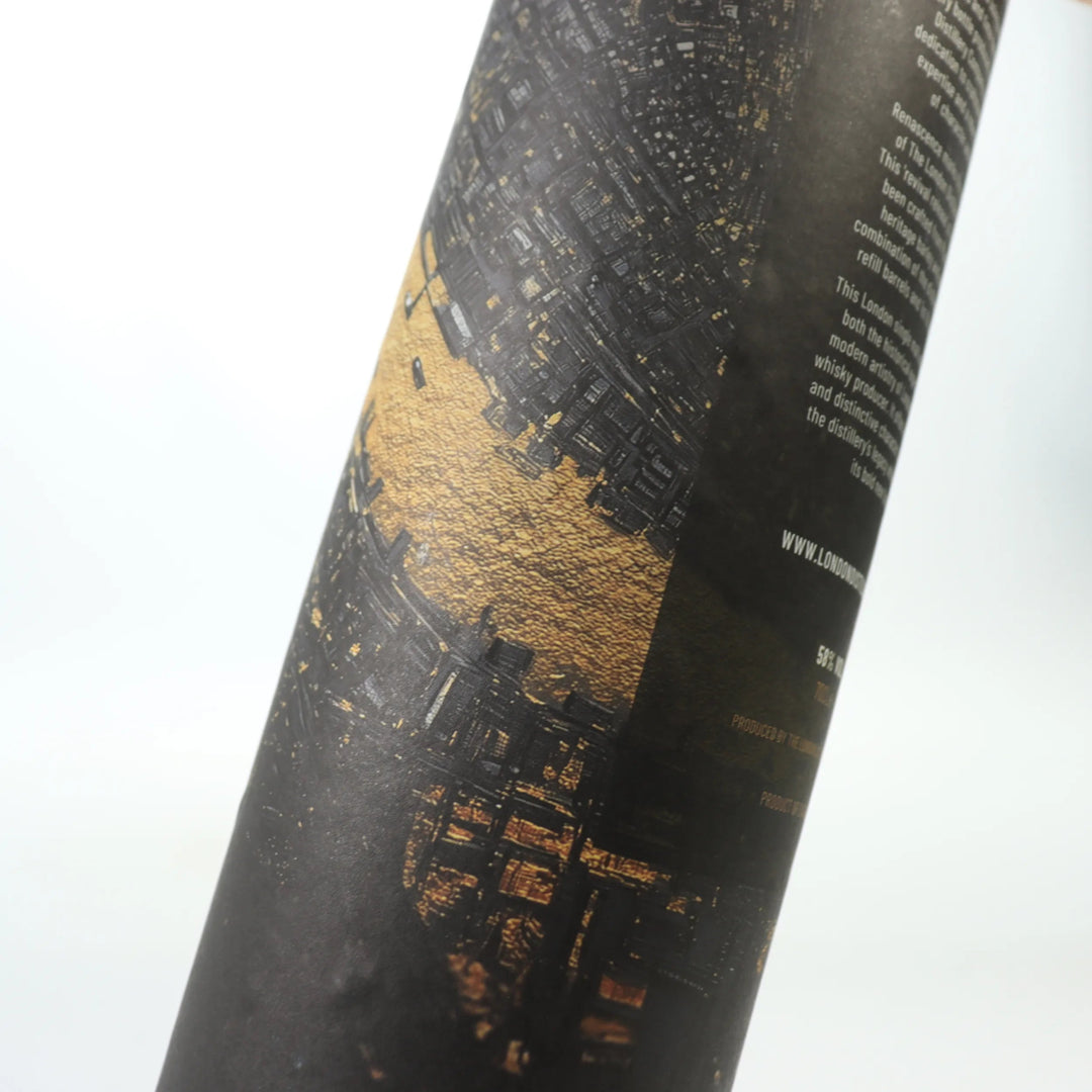 Close up of The London Distillery Company's 'Renascence' whisky packaging tube on a white background