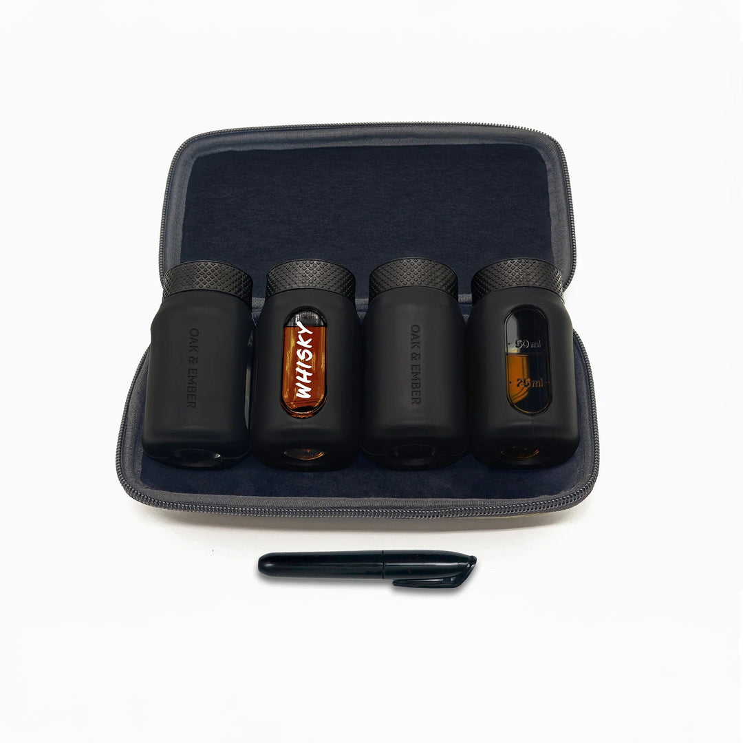 Set of portable whisky flasks with pen in a carrying case on a white background