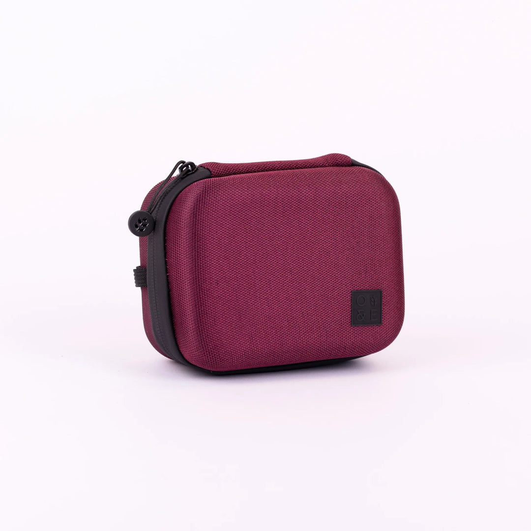 Oak &amp; Ember Mini Glask Traveller Set in a red carrying case with black accents on a white background