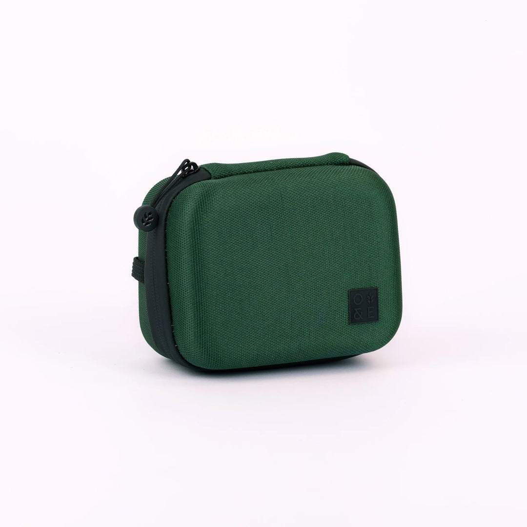 Oak &amp; Ember Mini Glask Traveller Set in a green carrying case with black accents on a white background