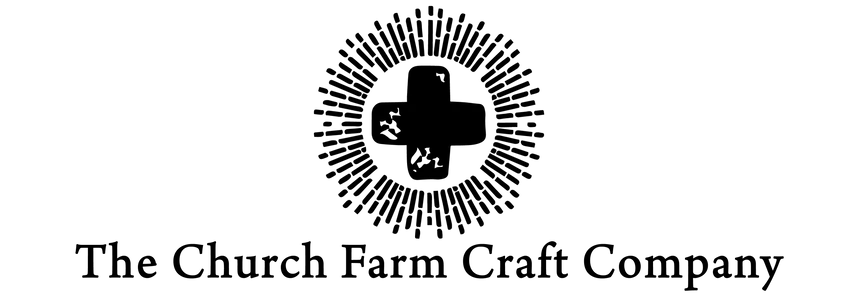 Logo of The Church Farm Craft Company with a cross design on a white background