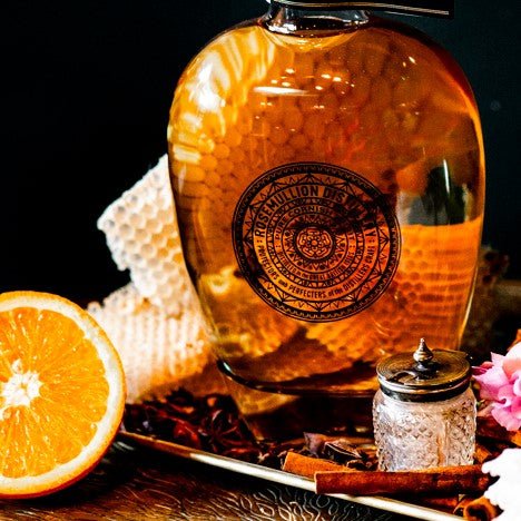 Bottle of Rosemullion Honey Rum with half an orange