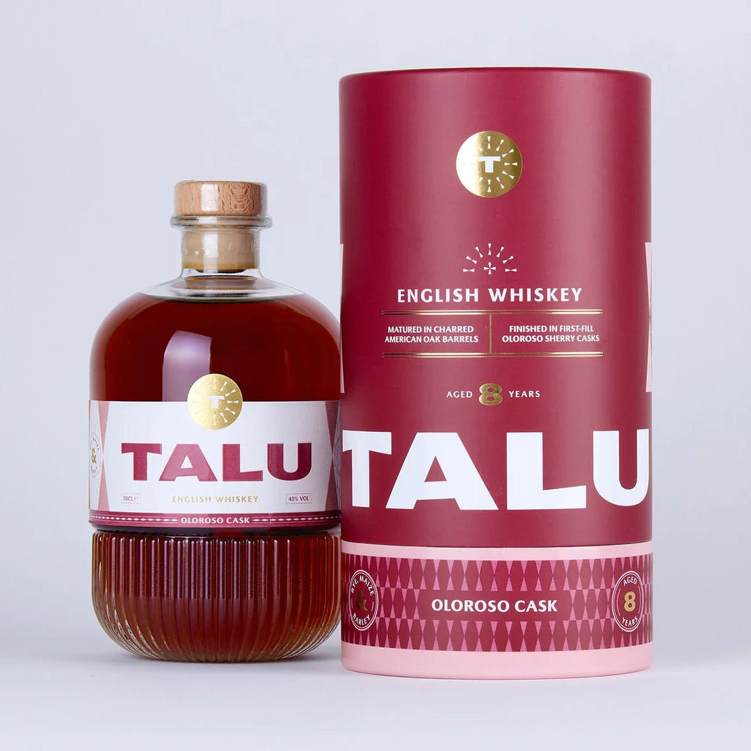 A bottle of Talu Oloroso Cask English Whiskey with amber-brown liquid and a white label, standing next to its tall dark red cylindrical packaging box on a light gray background.