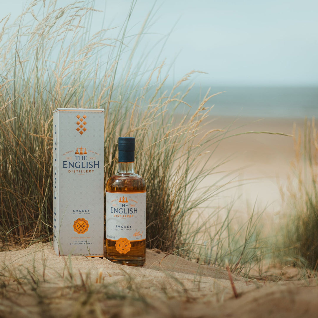 The English Distillery Smokey Single Malt Whisky with presentation box on a sand dune - Digital Distiller