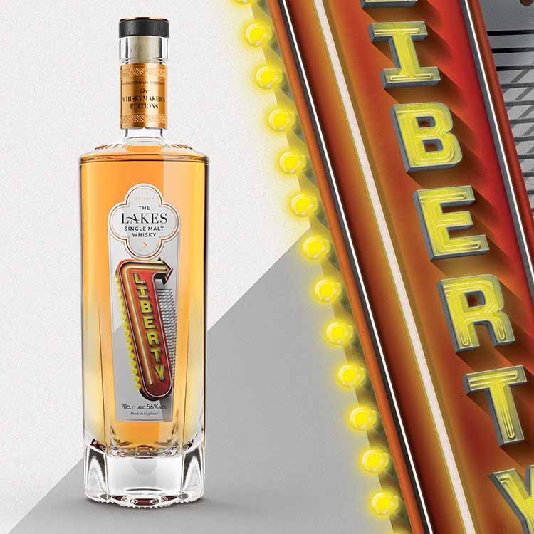 Bottle of 'The Lakes' whiskey with a neon sign in the background