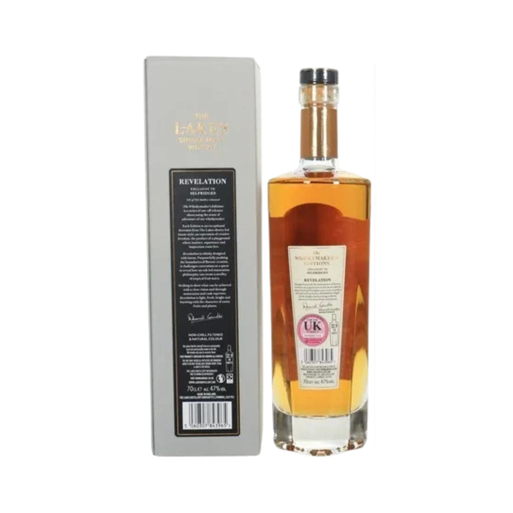Bottle of Lakes Distillery Revelation whisky with back label and presentation box on a white background