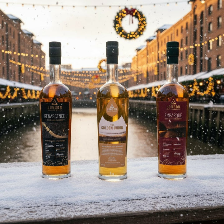 Three bottles of London Distillery Company Whisky with different labels on a white background