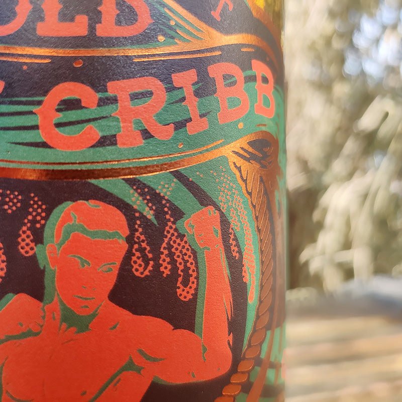 Close-up of a bottle of Old Market Upper Cut 59% Alc Gin label branding and artistic design.