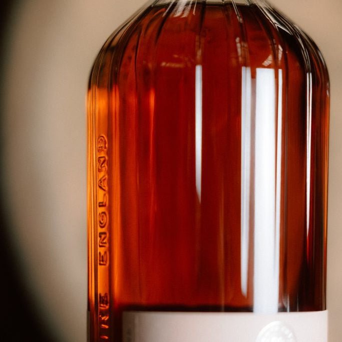 Close-up of a Wire Works glass whisky bottle