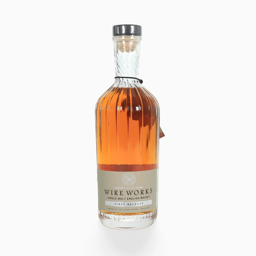 Bottle of White Peak Distillery First release English Whisky showing front label on a white background