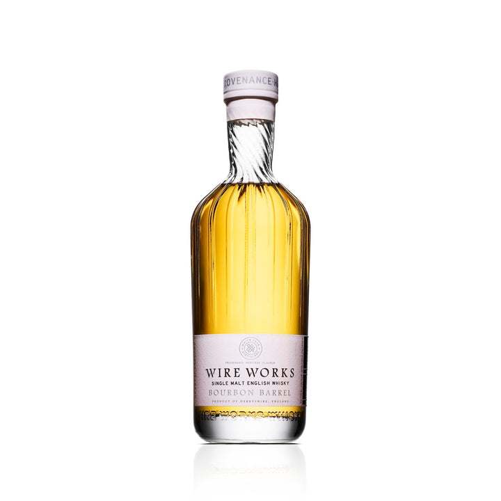 Bottle of Wire Works Bourbon barrel whisky on a white background