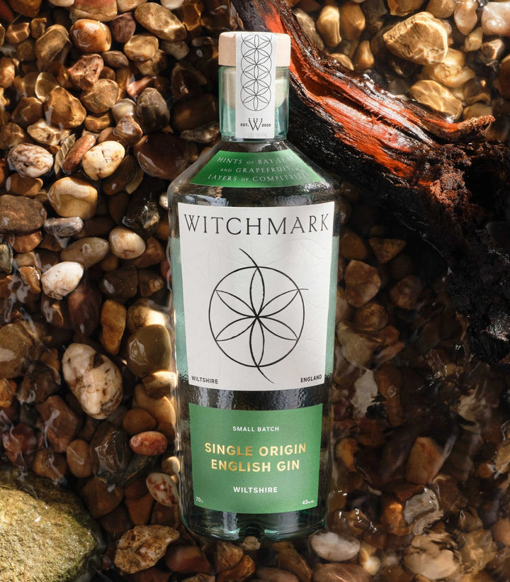 Bottle of Witchmark Single Origin English Gin on a stone surface