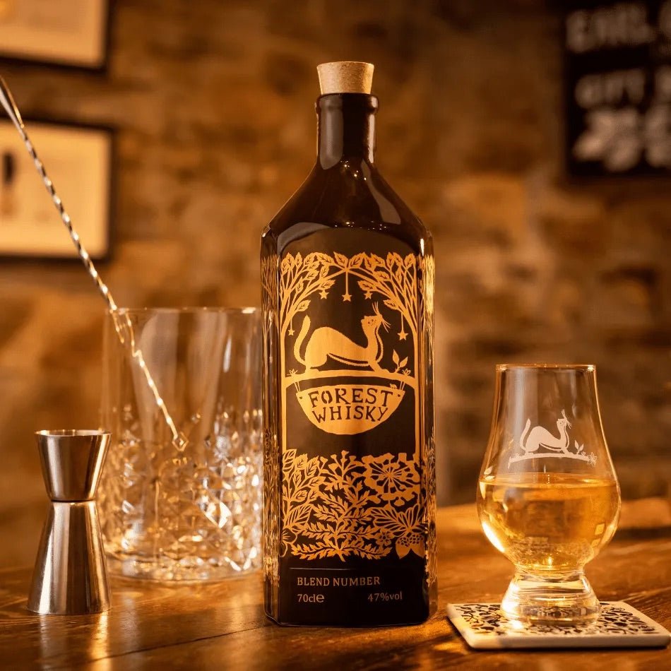 Forest Distillery English Whisky bottle with glass on a wooden table top - Digital Distiller